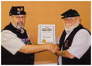 Ken Stelzel receives award from CC Andy Bollen
